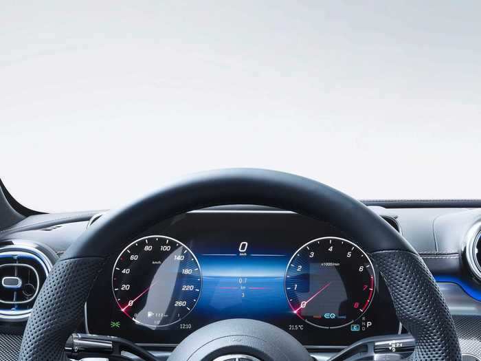 The steering wheel has touch-control buttons.