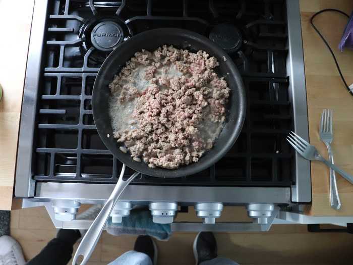 Once the turkey was browned, we had to dump the excess liquid into the sink, which was a challenge.