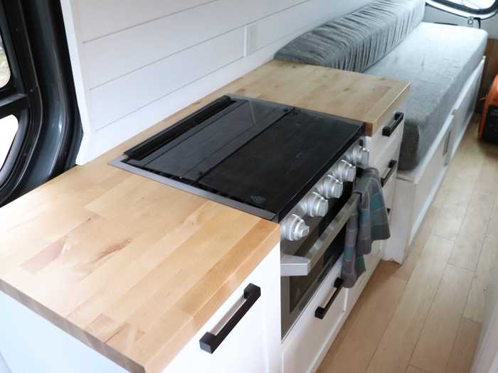 On the opposite wall, there was a stove, an oven, and plenty of counter space.