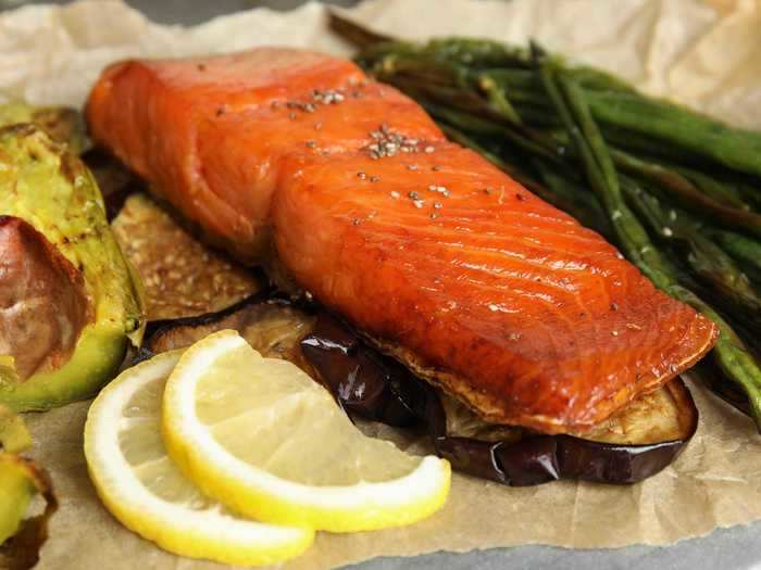 Salmon and vegetables can be cooked together in the air fryer.