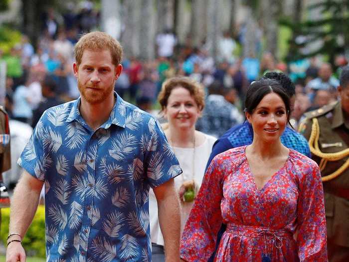 During her 2018 visit to Fiji, Markle wore a silk floral dress by Figue that complimented Harry