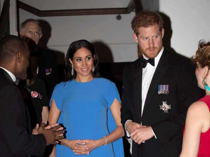 Markle wore a blue cape dress by Safiyaa to a state dinner in Fiji in 2018.