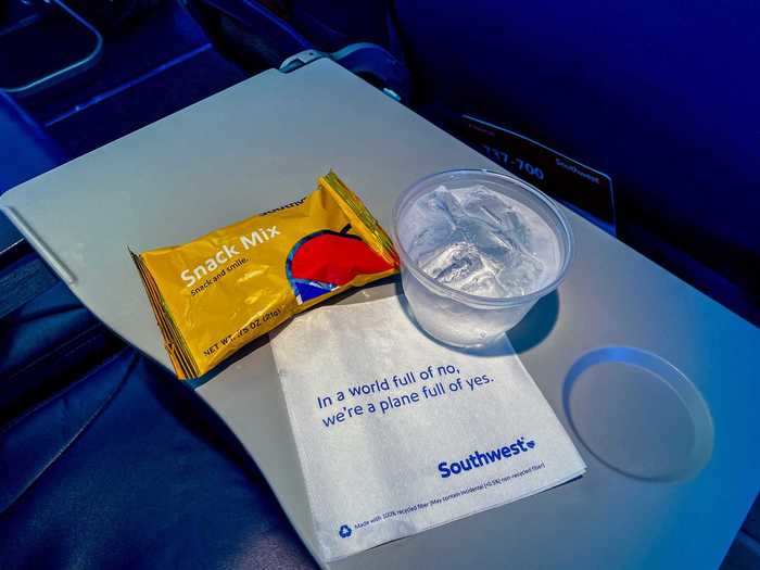 The in-flight offering is basic: a cup of ice water and a snack mix. It isn