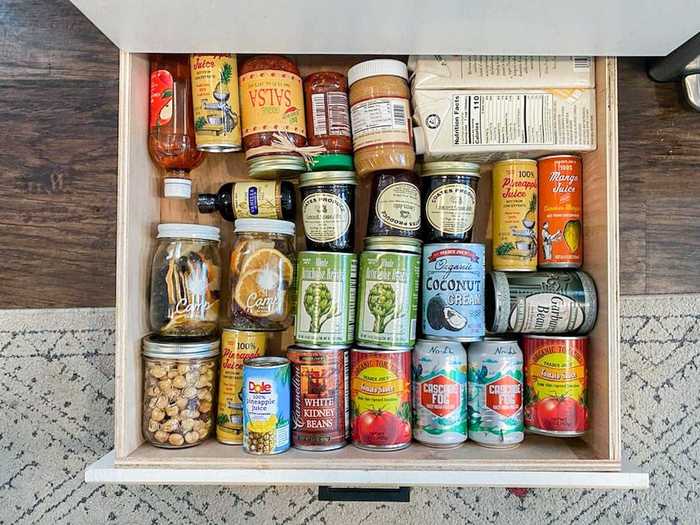 Underneath the kitchen cabinets, hidden drawers pull out with more pantry storage.