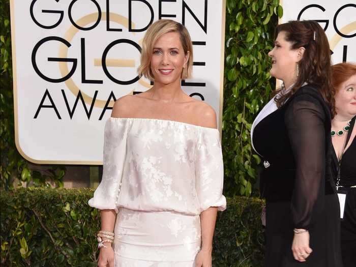 Kristen Wiig wore a bridal gown to the 2015 Golden Globe Awards.