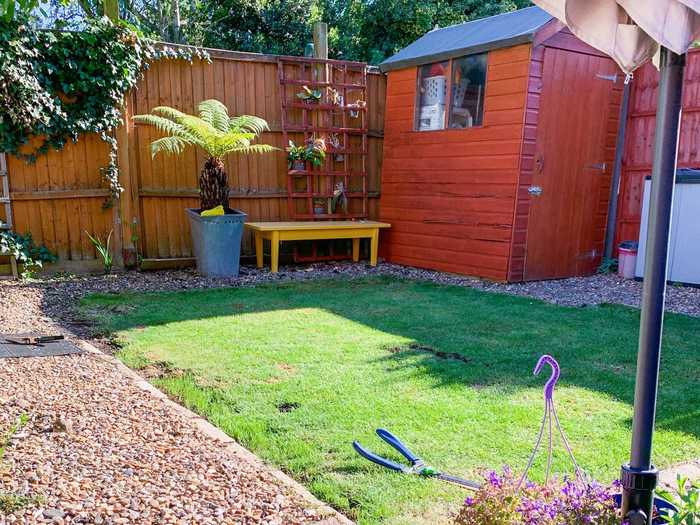 The yard is less than half the size of the interior, and it has a storage shed.