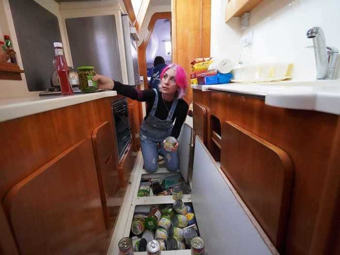 Storing groceries aboard the Sueiro family sailboat can get difficult, but luckily they have storage beneath the floorboards.