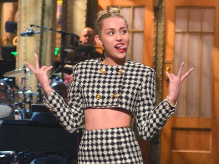 Miley Cyrus hosted during two distinct eras of her career. Once during "Bangerz," when she was rocking space buns and twerking all the time, and once during the "Dead Petz" era when she was only wearing plastic jewelry and neon colors.