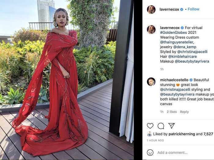 Laverne Cox wore bright-red Thai Nguyen dress with statement sleeves and a plunging neckline.