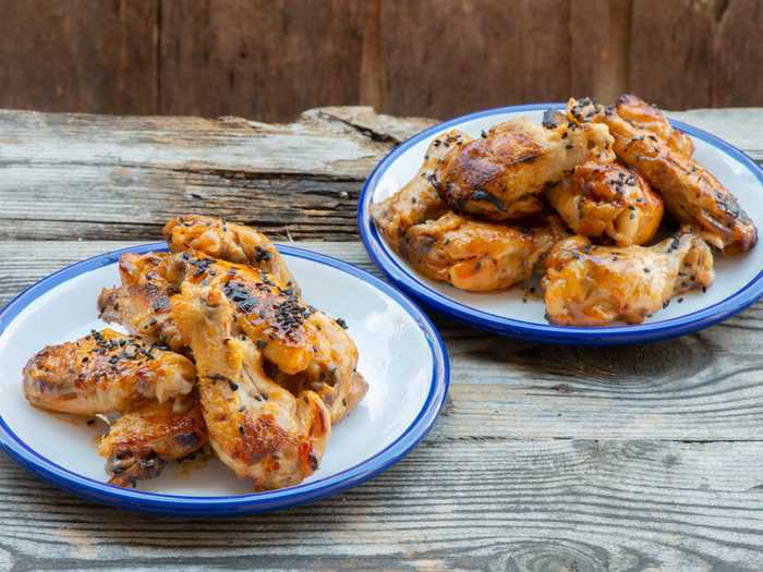 Chicken wings become extra flavorful when coated in peanut butter.