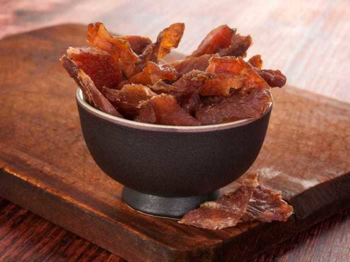 Beef jerky and a pear are loaded with proteins your body needs.