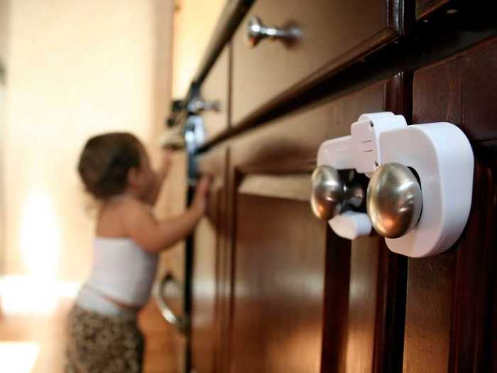 The pediatricians also recommend locking cabinets with potentially harmful items, like cleaners, plastic bags, and heavy pots.