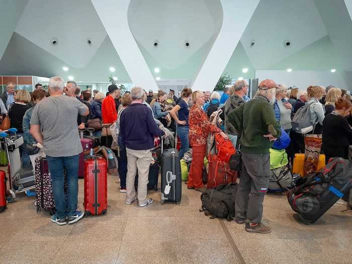 Travelers rushed to get home ahead of international flight restrictions