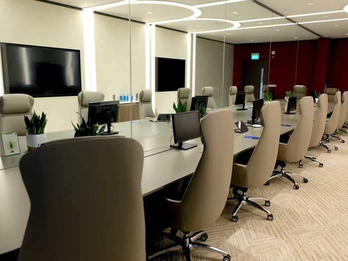 The largest meeting room available is a board room with a videoconferencing setup that can host up to 11 people on each side.