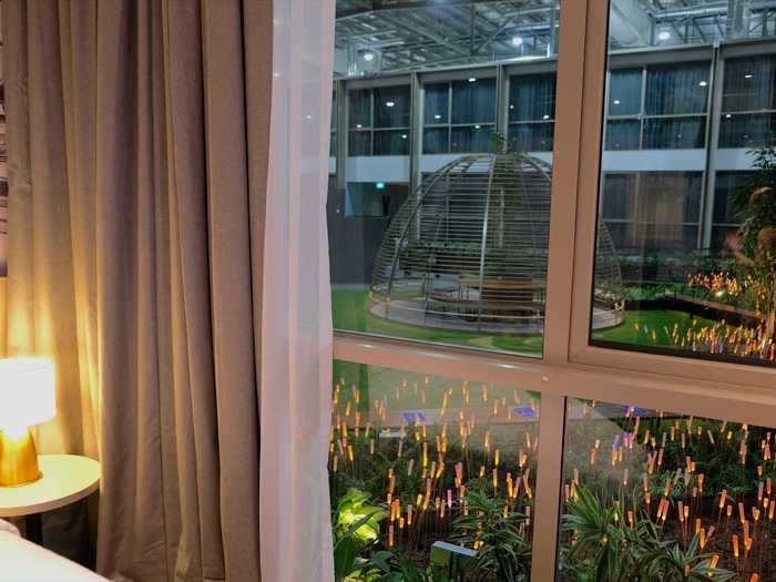 The Premier King rooms overlook the courtyards, where live plants are mixed with glowing optical fiber lights designed to resemble fields of lalang, a type of grass native to the region.