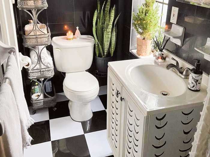 In the bathroom, Fuller added white vinyl stickers to the black-tiled flooring, giving it a checkerboard feel.