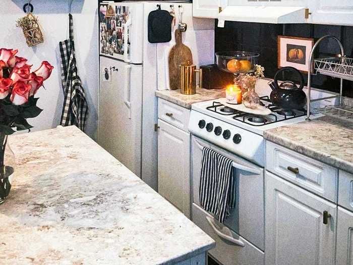 Also in the kitchen, Fuller added an island and stick-on marble countertops.