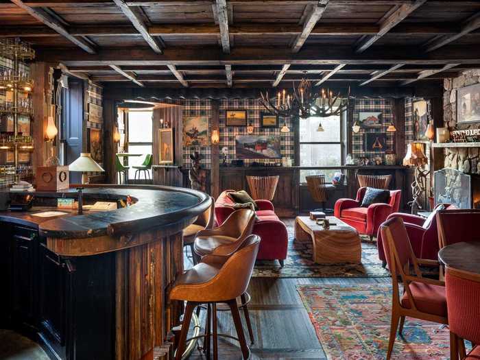 The 4,950-square-foot space is filled with antiques and customizations. Their second-floor "Saloon Room" is just one example of the elaborate personalization seen throughout.