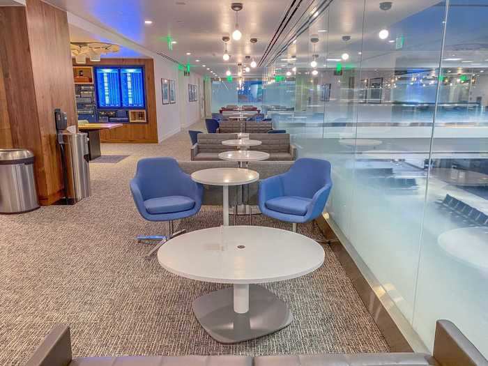 The seating area is arranged in a horseshoe pattern above the concourse, with floor-to-ceiling windows on each side to give an open feeling.