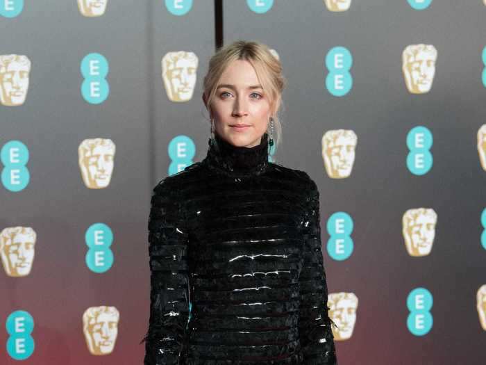 Saoirse Ronan also rocked all-black with a high-neck Chanel gown with a sheer skirt.