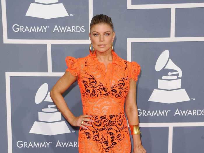 Fergie wore a lacy orange dress with black undergarments at the 2012 ceremony.