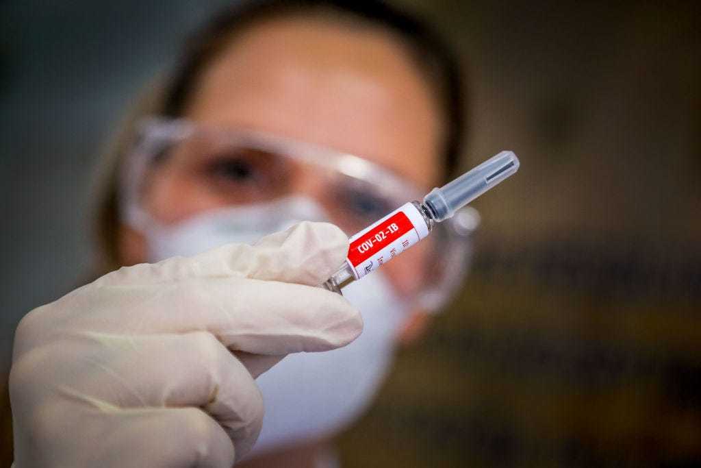 A nurse shows a COVID-19 vaccine produced by Chinese company Sinovac Biotech at the Sao Lucas Hospital, in Porto Alegre, southern Brazil