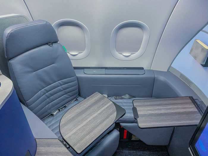 An additional tray table is built-in so companions can share a meal or get work done together. And if traveling solo, the table can also be used as simply an additional countertop to hold papers, a laptop, or food items.