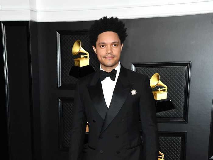 Trevor Noah walked the red carpet in a classic black tuxedo.