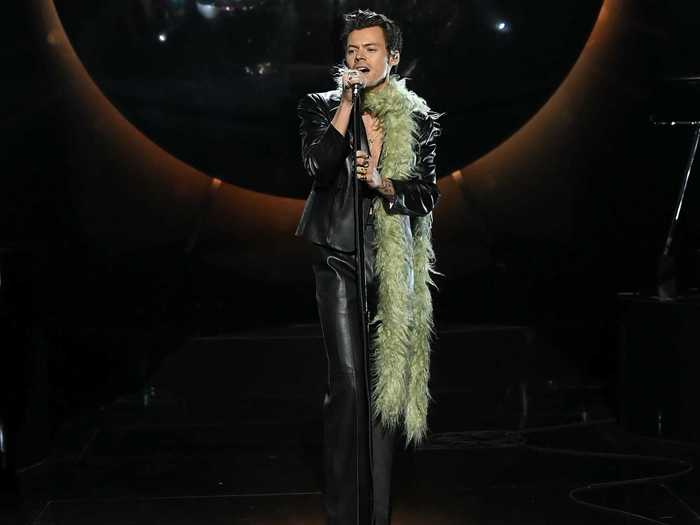 Harry Styles wore a leather suit and a green scarf to perform at the Grammy Awards.