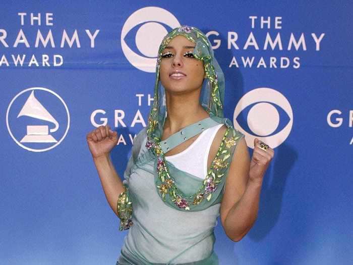 Alicia Keys went with a see-through veil outfit with jeans and a white tank top in 2002.