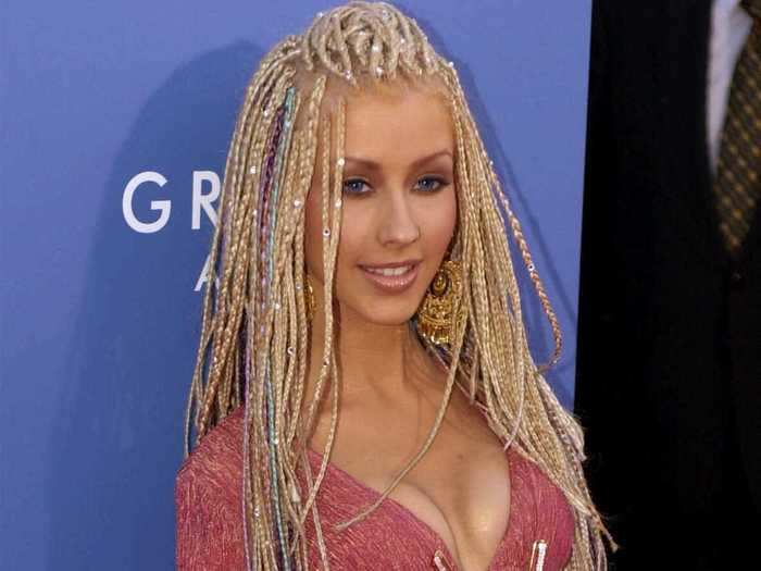 The next year, Christina Aguilera decided to go for a daring cutout dress and cornrows in her hair.