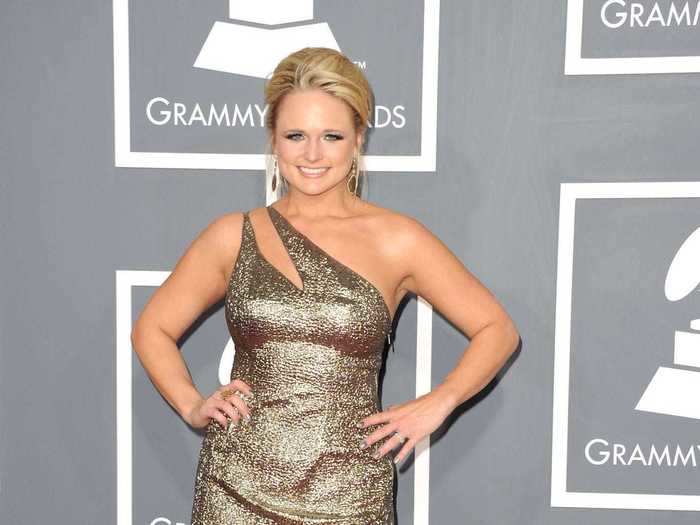 February 2011: For her award-winning night at the Grammys. Miranda Lambert wore a metallic Edition by Georges Chakra dress that featured a single cut-out strap.