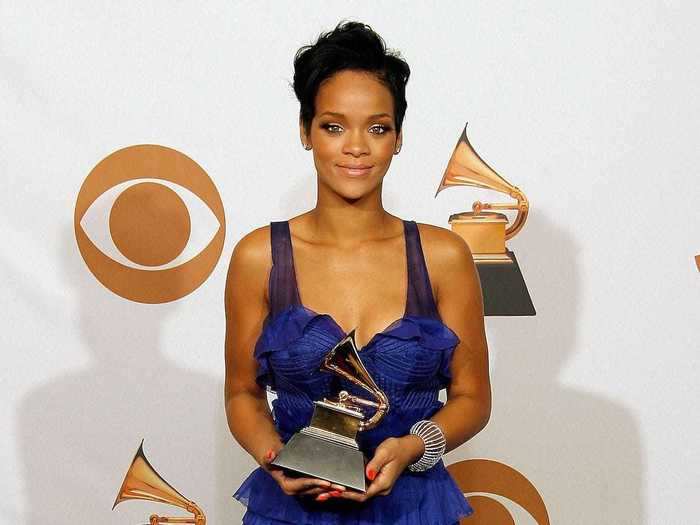 February 2008: Rihanna dressed in a voluminous and vibrant purple dress to pose with her first Grammy.