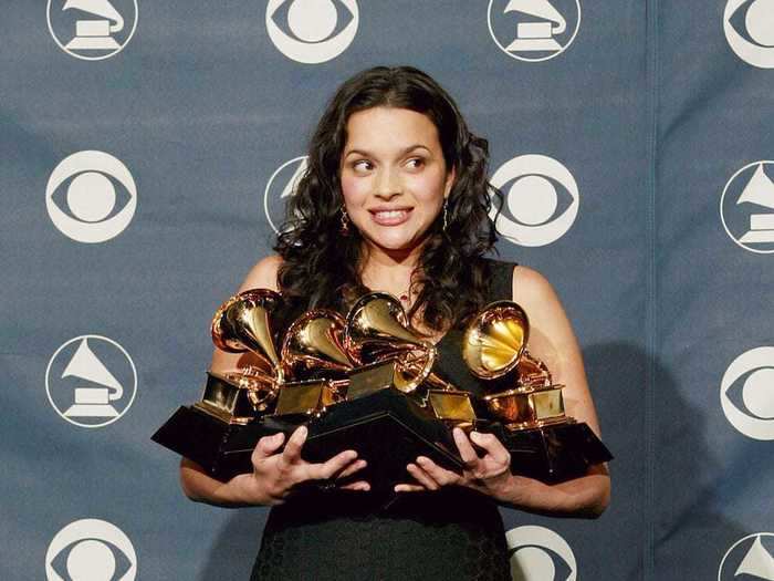 February 2003: Norah Jones racked up five Grammy awards wearing a forest-green, tea-length dress with strappy ankle sandals.