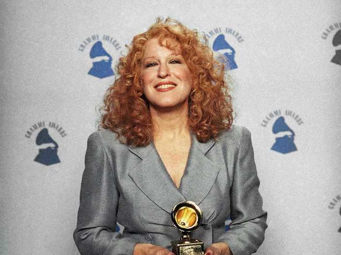 February 1990: Bette Midler went for a polished look in her bluish-gray blazer and matching floor-length skirt.