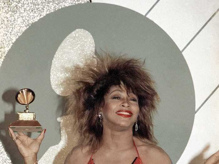 February 1985: Tina Turner stole the show - and took home three Grammys - with her performance in a shimmery red and black halter dress.