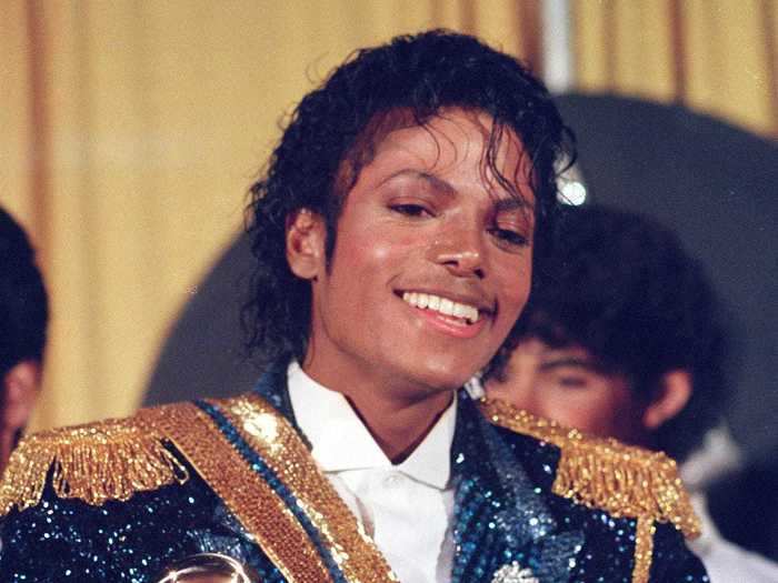 February 1984: Michael Jackson cradled his eight Grammys in a sparkly blue and gold military jacket with his single bedazzled glove.