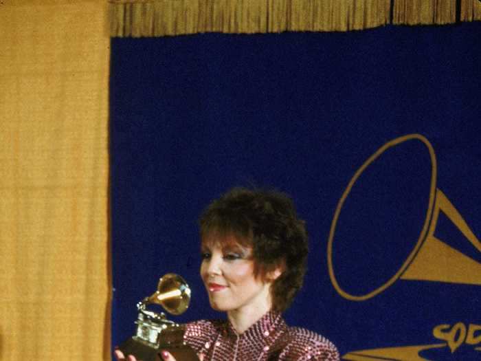 February 1981: Pat Benatar looked ultra-cool accepting her award in black leather pants and a puffy-sleeved pink sequin blazer, styled with an oversized belt.