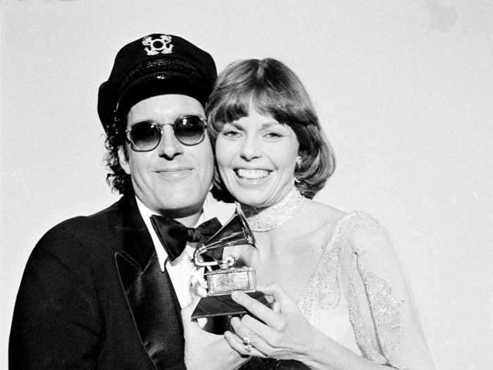 February 1976: Toni Tennille of Captain and Tennille wore a stunning yellow gown detailed with crystals and a steep V-neck.