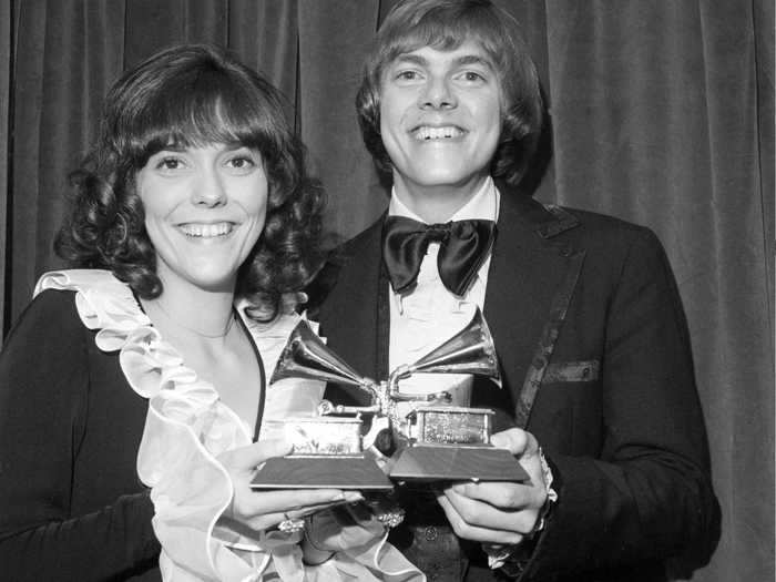 March 1971: The Carpenters coordinated in dark, ruffled ensembles for their super 