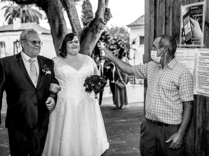 At other weddings, temperature checks were mandatory - even for the bride.