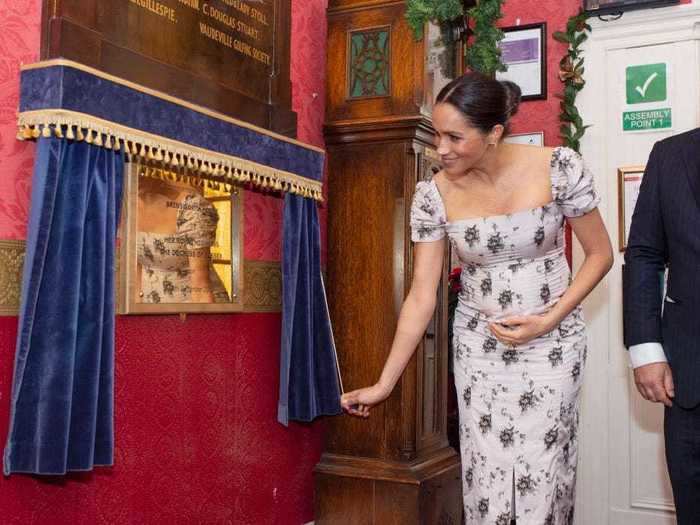 She wore a white, floral dress with a square neckline while visiting the Royal Variety Charity