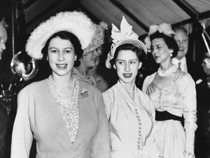 She wore the same outfit again a month later with a different hat, bag, gloves, and pin to attend a wedding in July 1948.