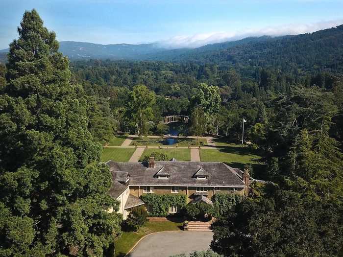 Green Gables comprises seven houses with a total of 32 bedrooms, three swimming pools, tennis courts, a barn structure, and expansive grounds that include orchards, formal gardens, and woodlands.