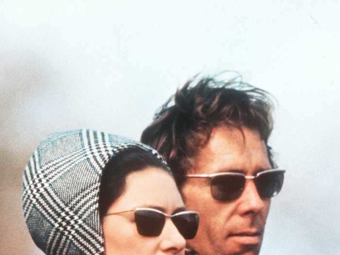 Princess Margaret, photographed with her husband in 1970, opted for a black-and-white plaid coat and matching hat.