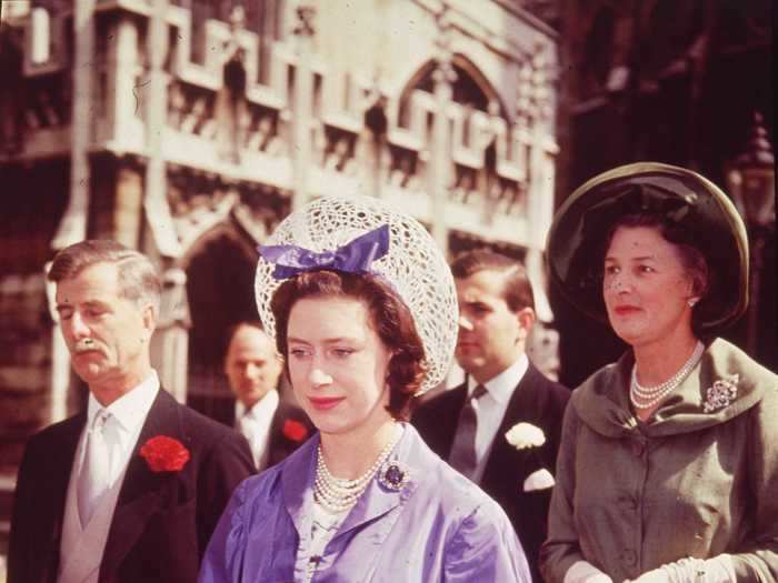 While attending a wedding at Westminster Abbey in 1962, Princess Margaret wore a purple coat and coordinating floral dress.