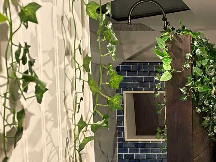 The bathroom, located right next to the bedroom, has a composting toilet and a rainfall shower.