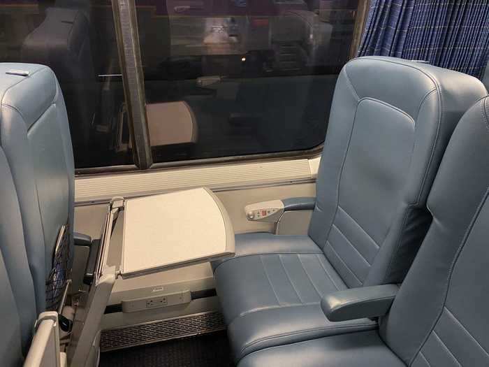 The train had all of the perks that the Spirit Airlines flight did and more. Seat amenities included a tray table...