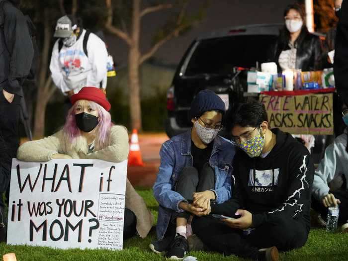 A rallygoer held a sign that read, "What if it was your mom?"