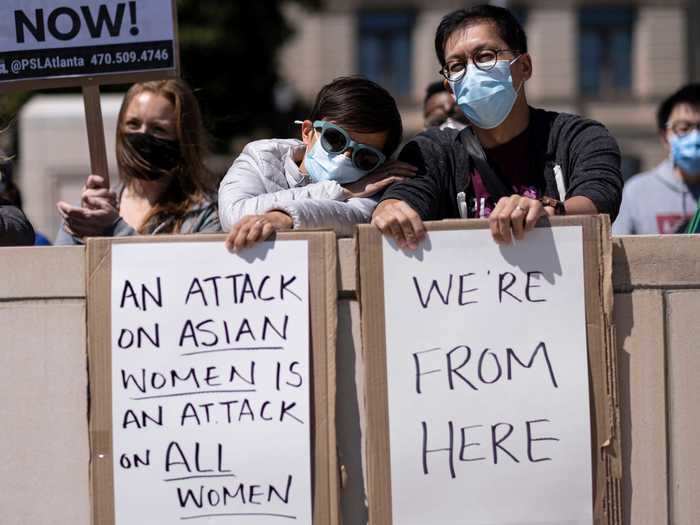 Demonstrators in Georgia held up signs that called out anti-Asian racism, which has spiked during the pandemic.